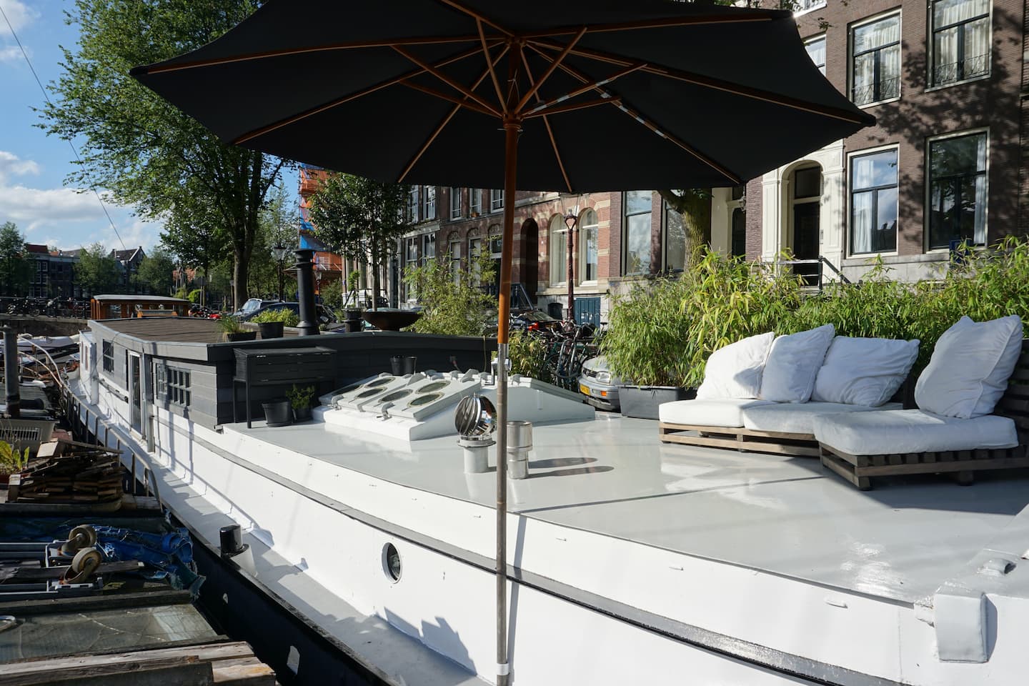 The houseboat with terrace on an Amsterdam canal